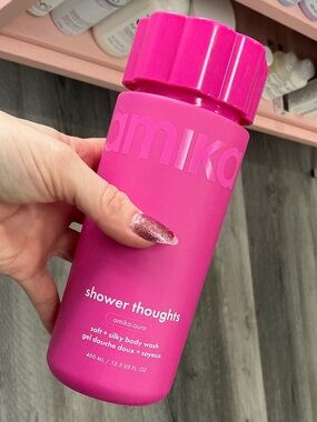 amika hot pink shower thoughts body wash bottle
